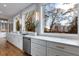 Modern kitchen with white cabinets and a large marble island at 2571 Sharondale Ne Dr, Atlanta, GA 30305
