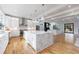 Open concept kitchen with large island, marble countertops, and hardwood floors at 2571 Sharondale Ne Dr, Atlanta, GA 30305