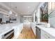 Modern kitchen with white cabinetry, marble countertops, and stainless steel appliances at 2571 Sharondale Ne Dr, Atlanta, GA 30305