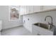 Laundry room with built-in sink and cabinets at 2571 Sharondale Ne Dr, Atlanta, GA 30305