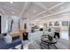 Open living room showcasing hardwood floors, stylish furniture, and a view into the kitchen at 2571 Sharondale Ne Dr, Atlanta, GA 30305