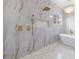 Shower with marble tile, built-in niche, and rainfall shower head at 2571 Sharondale Ne Dr, Atlanta, GA 30305