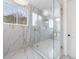 Large walk-in shower with marble tile and glass enclosure at 2571 Sharondale Ne Dr, Atlanta, GA 30305