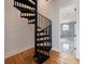 Modern black metal spiral staircase leading to upper level at 2571 Sharondale Ne Dr, Atlanta, GA 30305