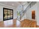 Modern staircase with metal railing and glass-paneled doors at 2571 Sharondale Ne Dr, Atlanta, GA 30305