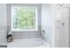 Bathroom with garden tub, shower, and large window at 4268 Notting Hill Dr # 27, Atlanta, GA 30331