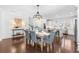 Bright dining room features a chandelier and hardwood floors at 164A Goshen Ln, Woodstock, GA 30188