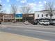 Street-level view of shops and businesses in a town center at 164 Goshen Ln, Woodstock, GA 30188