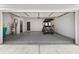 Finished garage with golf cart and epoxy flooring at 164A Goshen Ln, Woodstock, GA 30188