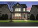 Two-story house with gray siding, porch, and red chairs at 164A Goshen Ln, Woodstock, GA 30188