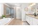 Main bathroom with soaking tub, walk-in shower, and double vanity at 164 Goshen Ln, Woodstock, GA 30188