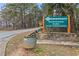 Woodstock Park entrance sign, featuring dog park and trail access at 164A Goshen Ln, Woodstock, GA 30188