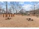 Wooden play structures and picnic tables in a playground setting at 164A Goshen Ln, Woodstock, GA 30188