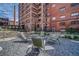 Beautiful courtyard with Adirondack chairs, a fire pit and industrial brick buildings in the background at 170 Boulevard Se # E411, Atlanta, GA 30312