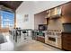 Modern kitchen featuring stainless steel appliances, a black countertop, and an island at 170 Boulevard Se # E411, Atlanta, GA 30312