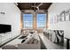 Modern, oversized sectional sofa in a living room featuring vintage windows and a bar-height countertop at 170 Boulevard Se # E411, Atlanta, GA 30312