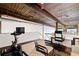 Loft office with exposed ceilings, a modern desk, and exercise bike at 170 Boulevard Se # E411, Atlanta, GA 30312