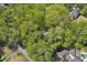 Aerial view showing house nestled in wooded lot at 4750 Rebel Trl, Atlanta, GA 30327