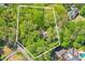 Aerial view of house surrounded by lush trees at 4750 Rebel Trl, Atlanta, GA 30327