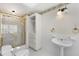 Bathroom with pedestal sink and shower/tub combo at 4750 Rebel Trl, Atlanta, GA 30327