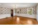 Bright dining room with hardwood floors and floral wallpaper at 4750 Rebel Trl, Atlanta, GA 30327