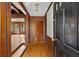 Wood paneled entryway with hardwood floors and built-in shelving at 4750 Rebel Trl, Atlanta, GA 30327