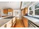 Galley kitchen with island, wood cabinets, and hardwood floors at 4750 Rebel Trl, Atlanta, GA 30327