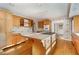 Bright kitchen with island, wood cabinets, and hardwood floors at 4750 Rebel Trl, Atlanta, GA 30327