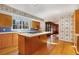 Well-lit kitchen with island, wood cabinets, and hardwood floors at 4750 Rebel Trl, Atlanta, GA 30327