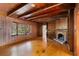 Spacious living room with hardwood floors, wood paneling, and fireplace at 4750 Rebel Trl, Atlanta, GA 30327