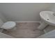 Small bathroom with pedestal sink, toilet and vinyl flooring at 48 Beaver Pt, Villa Rica, GA 30180