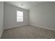 Simple bedroom with carpet flooring and window with blinds at 48 Beaver Pt, Villa Rica, GA 30180