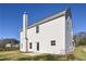 Two-story house, rear view, with white siding and a patio at 48 Beaver Pt, Villa Rica, GA 30180