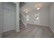 Foyer with hardwood floors, staircase, and coat closet at 48 Beaver Pt, Villa Rica, GA 30180