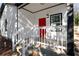 Charming front porch with white railing and red door at 1273 Oakland Sw Ter, Atlanta, GA 30310