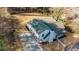 An aerial view of a well-maintained home featuring a new roof and a freshly paved driveway at 204 Elm St, Palmetto, GA 30268