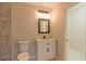 Updated bathroom features a white vanity, marble shower, and modern fixtures at 204 Elm St, Palmetto, GA 30268