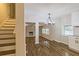 Open concept dining area with hardwood floors and chandelier at 204 Elm St, Palmetto, GA 30268