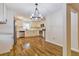 Bright, airy kitchen with stainless steel appliances, granite countertops, white cabinets, and hardwood floors at 204 Elm St, Palmetto, GA 30268