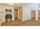 Modern kitchen with stainless steel appliances and hardwood floors at 204 Elm St, Palmetto, GA 30268
