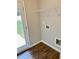 Laundry room with vinyl flooring, shelving and door to backyard at 48 Deer Pl, Villa Rica, GA 30180