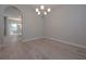 Dining room with hardwood floors, chandelier, and arched opening at 16 Deer Place, Villa Rica, GA 30180