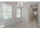 Bright dining room features hardwood floors and elegant chandelier at 16 Deer Place, Villa Rica, GA 30180