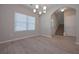 Dining room with hardwood floors, chandelier, and view of stairs at 16 Deer Place, Villa Rica, GA 30180