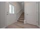 Entryway with staircase, storage closet, and hardwood floors at 16 Deer Place, Villa Rica, GA 30180