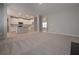 Open living room features a view of the kitchen and hardwood floors at 16 Deer Place, Villa Rica, GA 30180