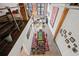 Open-concept dining and living space, with high ceilings and exposed brick, viewed from the loft at 170 Boulevard Se # H412, Atlanta, GA 30312