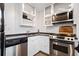 Modern kitchen featuring stainless steel appliances and sleek white cabinetry at 170 Boulevard Se # H412, Atlanta, GA 30312