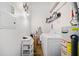 Practical laundry area with a washing machine, water heater, shelving, and overhead lighting at 170 Boulevard Se # H412, Atlanta, GA 30312