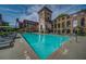 Inviting community pool with lounge chairs, umbrellas, and views of the historic mill buildings at 170 Boulevard Se # H412, Atlanta, GA 30312